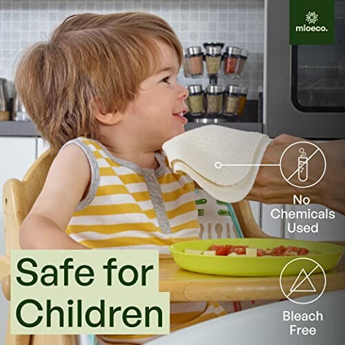 Child eating at table with a cloth near face, safe for children message.