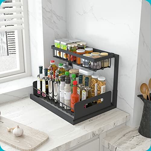 Two-tier kitchen spice rack organizer on a countertop with various bottles and jars.